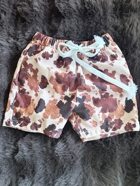 Brown cow print baby boy swim trunks size 12-18months